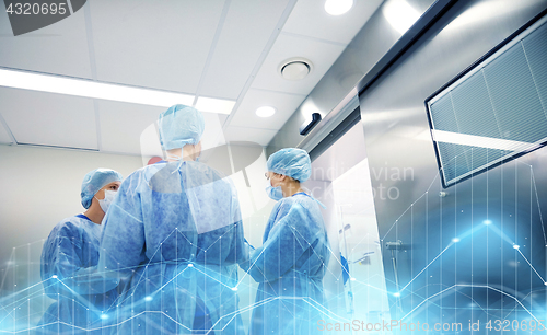 Image of group of surgeons in operating room at hospital