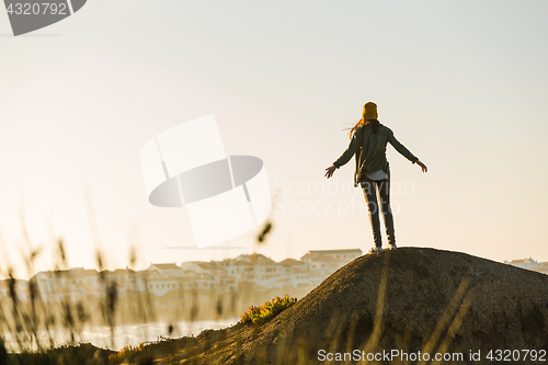 Image of Woman over the cliff