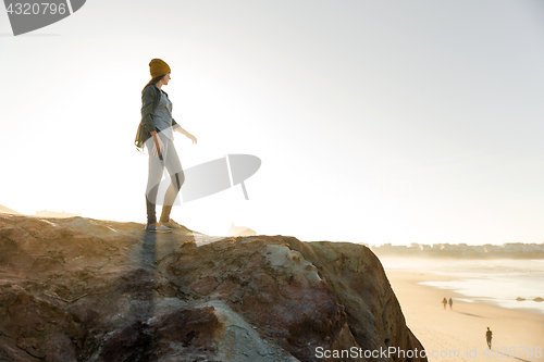 Image of Woman over the cliff