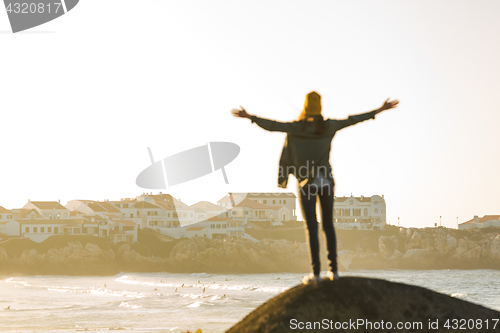 Image of Woman over the cliff