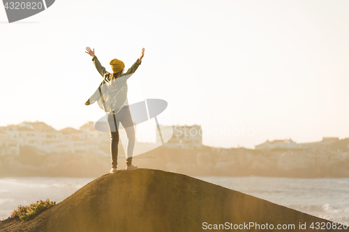 Image of Woman over the cliff