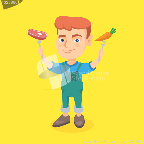 Image of Caucasian boy holding fresh carrot and steak.