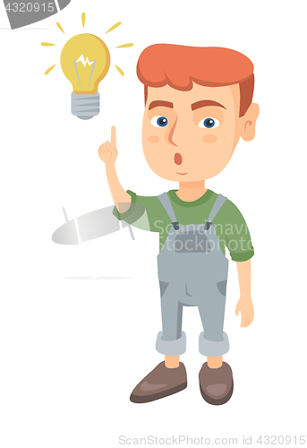 Image of Caucasian little boy pointing at the lightbulb.