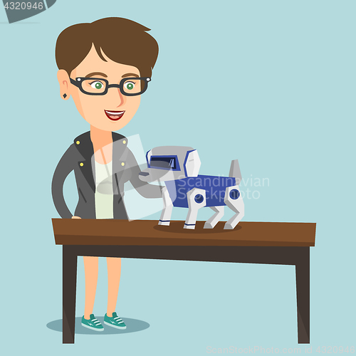 Image of Young caucasian woman playing with a robotic dog.