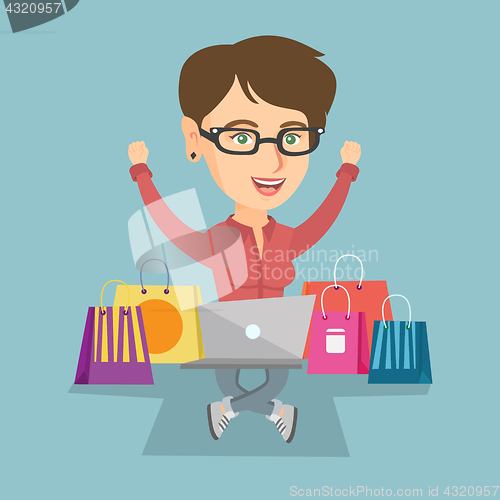 Image of Caucasian woman using a laptop for online shopping