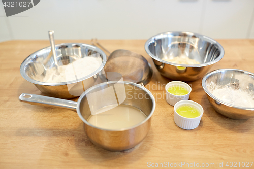 Image of bowls with flour and egg whites at bakery kitchen