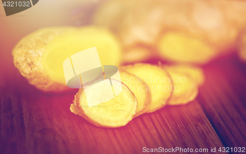 Image of close up of ginger root on wooden table