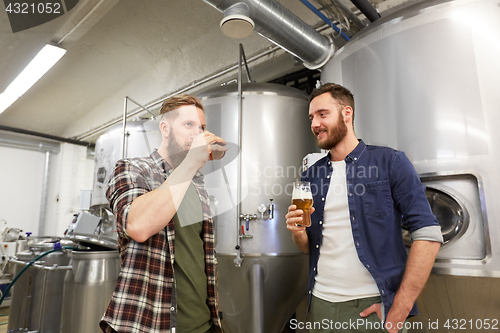 Image of men testing non-alcoholic craft beer at brewery