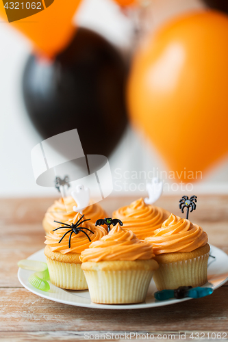 Image of halloween party cupcakes or muffins on table