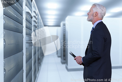 Image of Senior businessman in server room