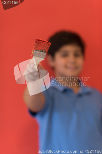 Image of Portrait of a happy young boy painter