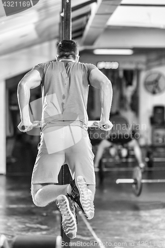 Image of man doing exercises parallel bars