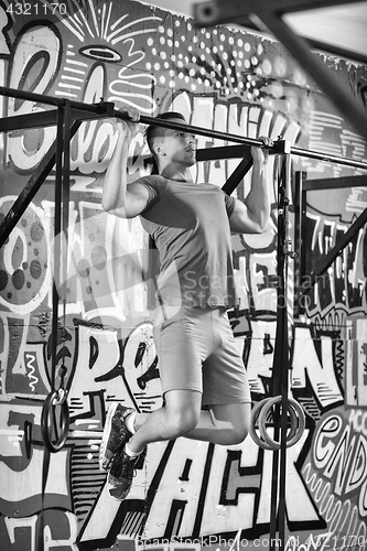 Image of man doing pull ups