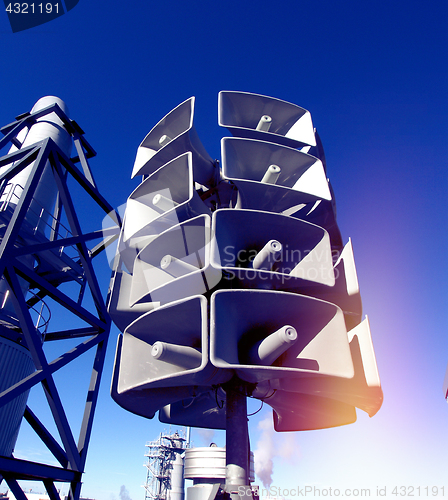 Image of Isolated loudspeakers with a natural blue background  