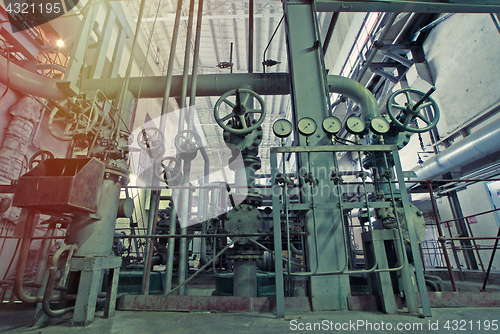 Image of Equipment, cables and piping as found inside of a modern industr