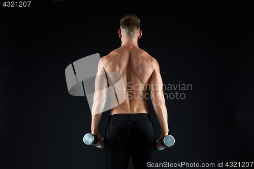 Image of man with dumbbells exercising