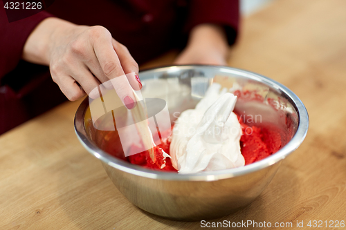 Image of chef making macaron batter at confectionery