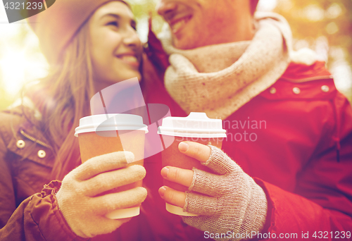 Image of close up of happy couple with coffee in autumn