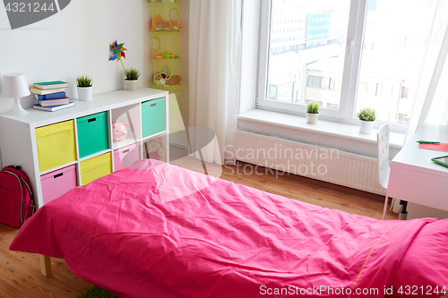 Image of kids room interior with bed, rack and accessories