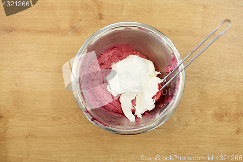 Image of macaron batter with whipped egg whites in bowl