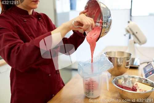 Image of chef making macaron batter at kitchen