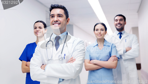 Image of group of happy medics or doctors at hospital