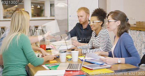 Image of Cheerful team working at table