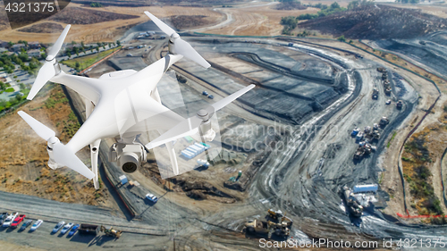 Image of Unmanned Aircraft System (UAV) Quadcopter Drone In The Air Over 