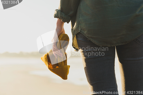 Image of Holding a yellow cap