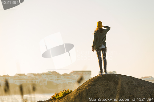 Image of Woman over the cliff