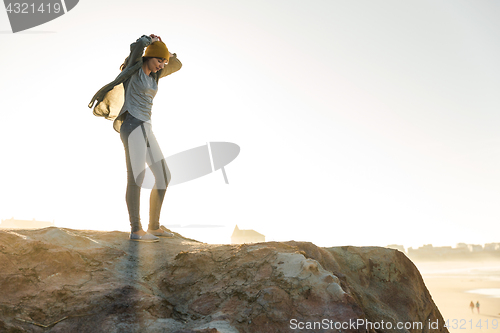 Image of Woman over the cliff