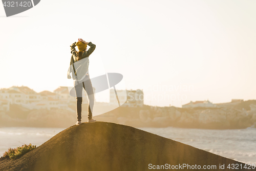 Image of Woman over the cliff