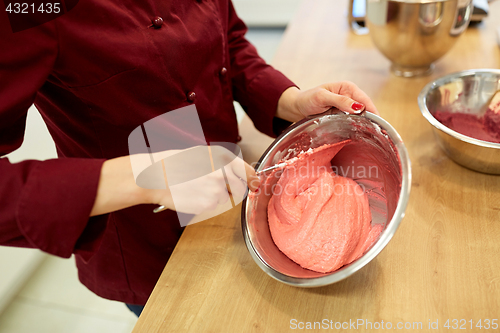 Image of chef making macaron batter at confectionery