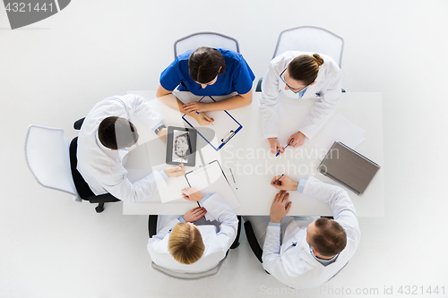 Image of doctors with jaw x-ray on tablet pc at clinic