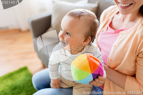 Image of happy young mother with little baby at home