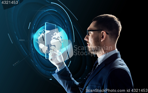 Image of businessman with tablet pc and virtual globe