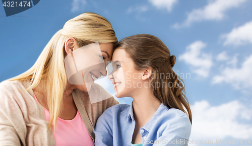 Image of happy family of girl and mother over blue sky