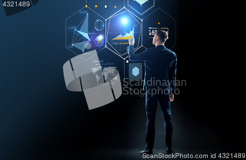 Image of businessman in suit touching virtual screen