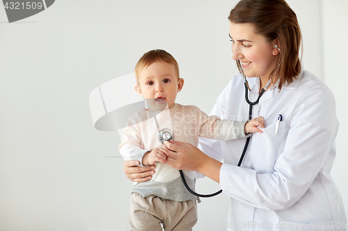 Image of happy doctor with stethoscope and baby at clinic