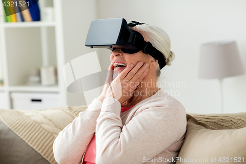 Image of old woman in virtual reality headset or 3d glasses