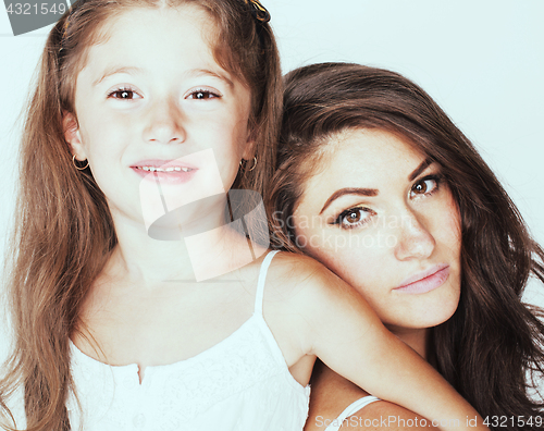 Image of young mother with little cute daughter emotional posing on white