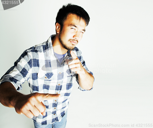 Image of young cute asian man on white background gesturing emotional, po