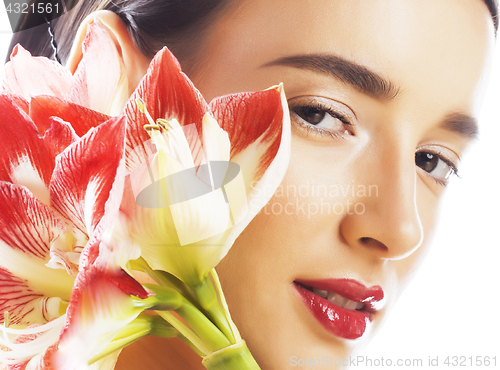 Image of young pretty brunette woman with red flower amaryllis close up i