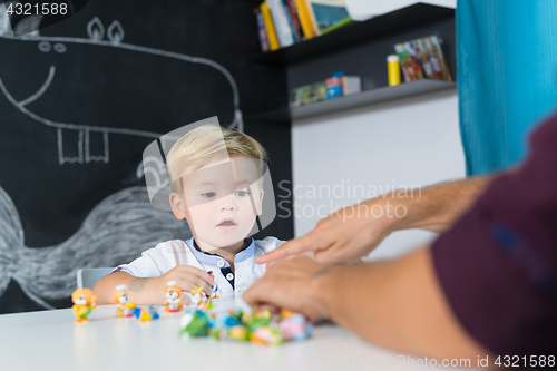 Image of Cute little toddler boy at child therapy session.