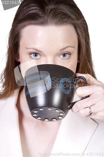 Image of Woman Drinking Coffee Standing Up