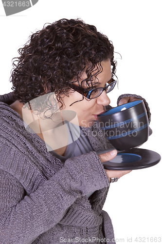 Image of Woman Drinking Coffee Standing Up