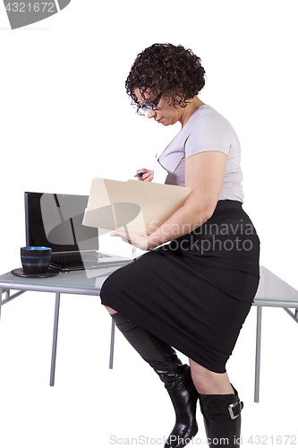 Image of Sexy Woman Sitting on the Desk