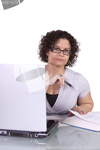 Image of Hispanic Businesswoman at Her Desk Working