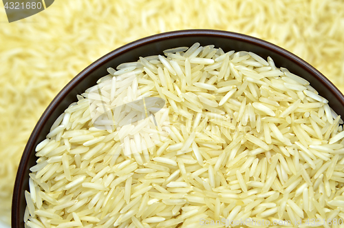 Image of White basmati rice with wooden bowl