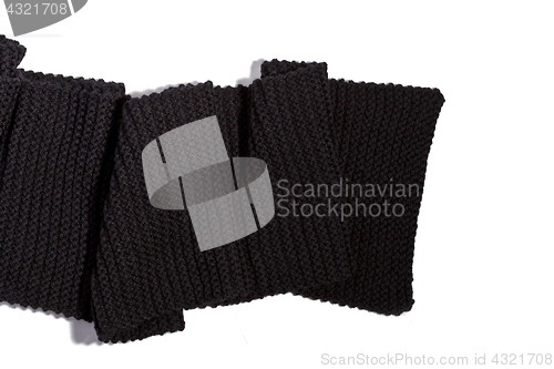 Image of knitted black scarf isolated on white background